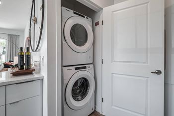 A white washer and dryer in a laundry room